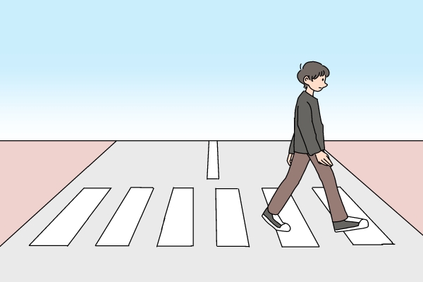 横断歩道を渡る男性のイラスト