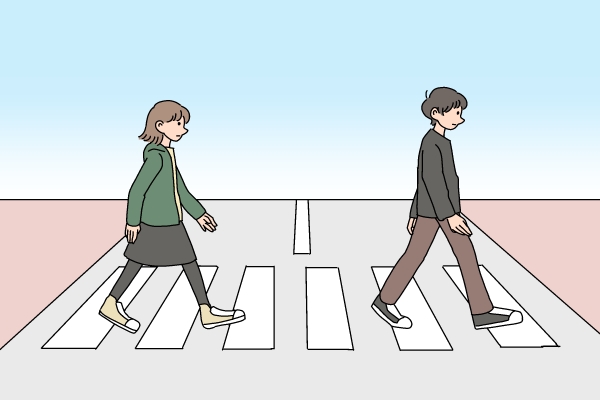 横断歩道を男女が渡るイラスト